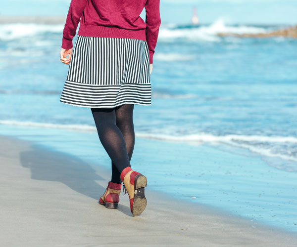 Walking along the sandy beach of Uradome Beach